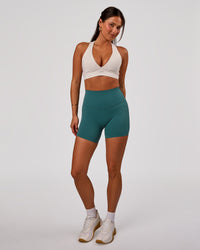 Woman wearing Elixir High-Rise 6” Short - Transformative Teal | Model:Bianca | Size:S | Thumbnail Index: 2