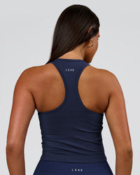 Woman wearing Flow Performance Shelf Bra Tank 2.0 - Future Navy | Model:Bianca | Size:S | Thumbnail Index: 1