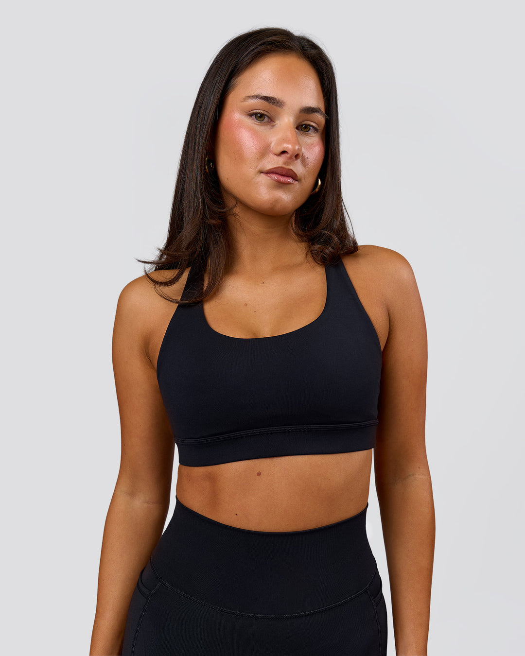 Woman wearing Flow Sports Bra - Black | Model:Bianca | Size:S - view 1