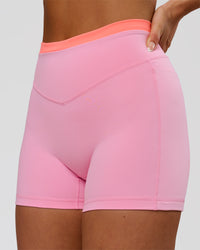Woman wearing Fusion Contrast V-Waist High-Rise 4" Short Pockets - Pink Rose-Hyper Orange | Model:Bianca | Size:S | Thumbnail Index: 0