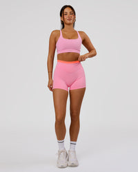 Woman wearing Fusion Contrast V-Waist High-Rise 4" Short Pockets - Pink Rose-Hyper Orange | Model:Bianca | Size:S | Thumbnail Index: 4