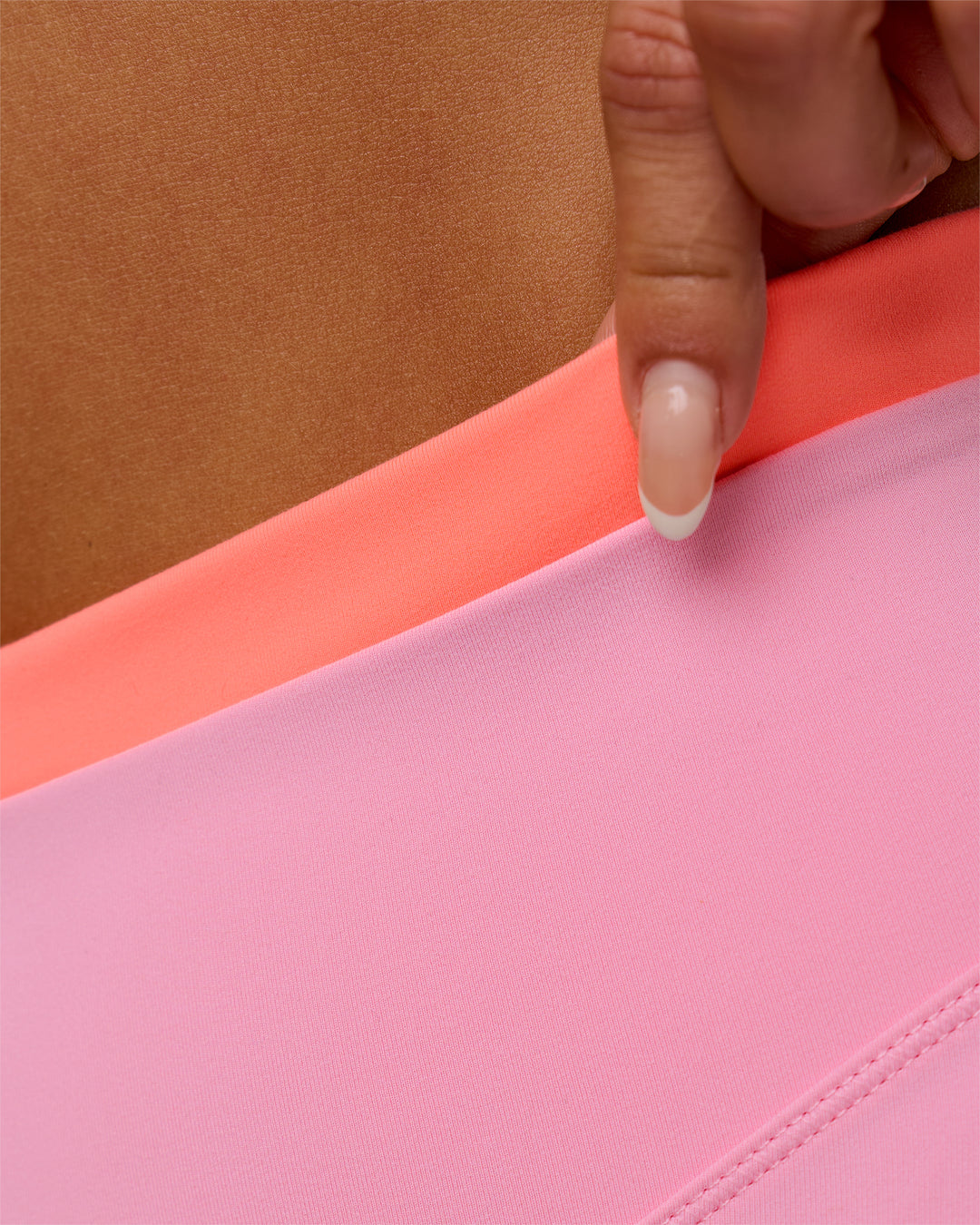 Woman wearing Fusion Contrast V-Waist High-Rise 4" Short Pockets - Pink Rose-Hyper Orange | Model:Bianca | Size:S - view 9