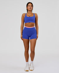 Woman wearing Fusion Contrast V-Waist High-Rise 4" Short Pockets - Power Cobalt-Pink Rose | Model:Bianca | Size:S | Thumbnail Index: 2