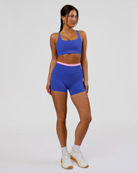 Woman wearing Fusion Contrast V-Waist High-Rise 4" Short Pockets - Power Cobalt-Pink Rose | Model:Bianca | Size:S | Thumbnail Index: 3