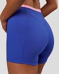 Woman wearing Fusion Contrast V-Waist High-Rise 4" Short Pockets - Power Cobalt-Pink Rose | Model:Bianca | Size:S | Thumbnail Index: 8
