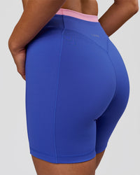 Woman wearing Fusion Contrast V-Waist High-Rise 6" Short Pockets - Power Cobalt-Pink Rose | Model:Bianca | Size:S | Thumbnail Index: 0