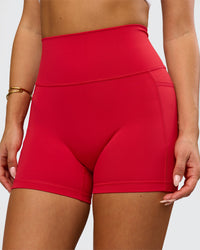 Woman wearing Fusion Ultra High-Rise 4" Short Pockets - Scarlet | Model:Bianca | Size:S | Thumbnail Index: 0