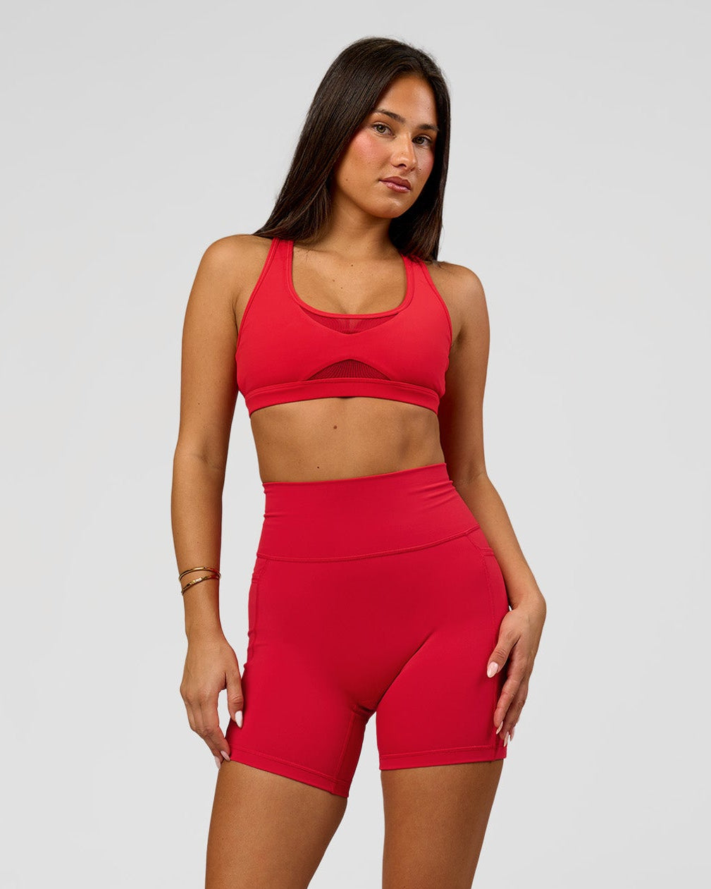 Woman wearing Fusion Ultra High-Rise 6" Short Pockets - Scarlet | Model:Bianca | Size:S - view 1