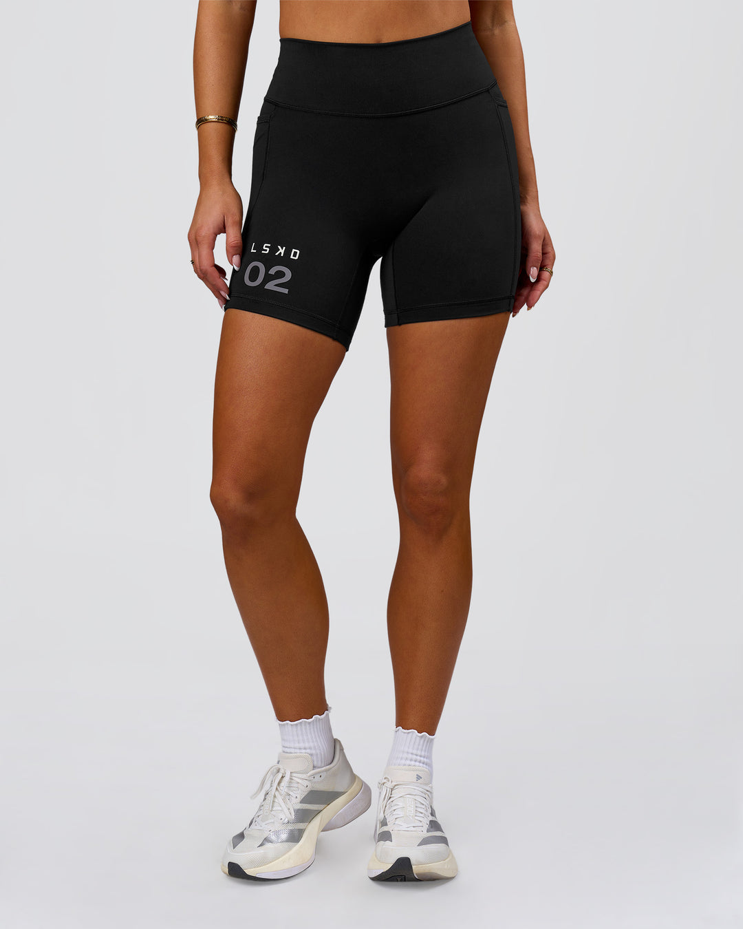 Woman wearing Fusion V-Contour High-Rise 6" Short Pockets - Black-Tech Department | Model:Bianca | Size:S - view 6