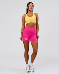 Woman wearing Fusion V-Contour High-Rise 6" Short Pockets - Ultra Pink-Tech Department | Model:Bianca | Size:S | Thumbnail Index: 4