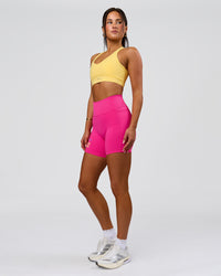 Woman wearing Fusion V-Contour High-Rise 6" Short Pockets - Ultra Pink-Tech Department | Model:Bianca | Size:S | Thumbnail Index: 5