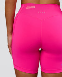 Woman wearing Fusion V-Contour High-Rise 6" Short Pockets - Ultra Pink-Tech Department | Model:Bianca | Size:S | Thumbnail Index: 8