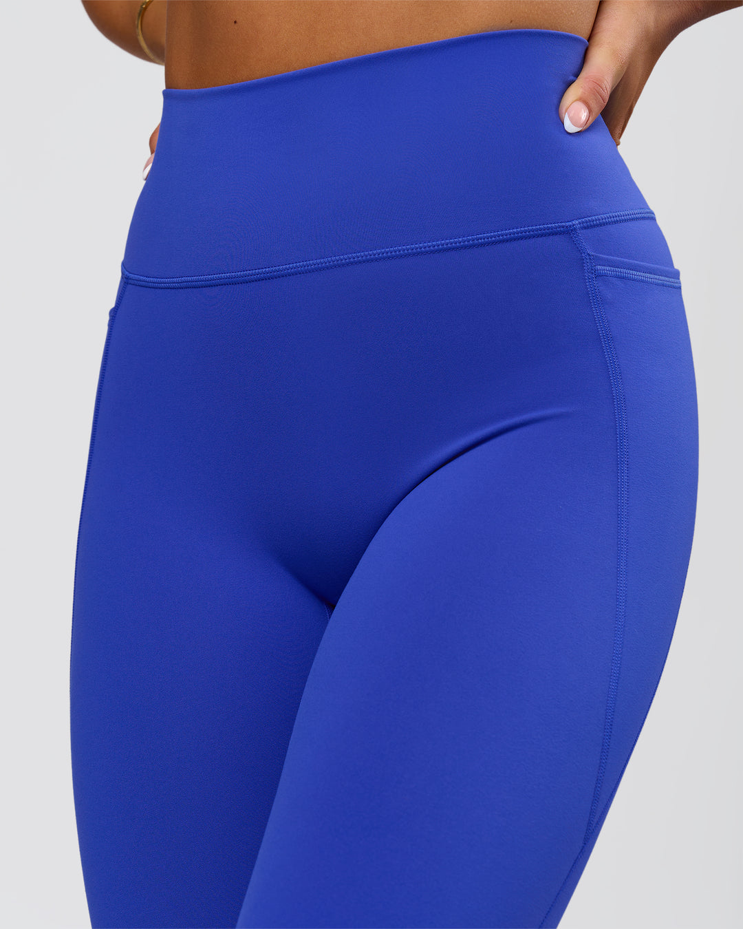 Woman wearing Fusion V-Contour Ultra High-Rise Full Length Legging Pockets - Power Cobalt | Model:Bianca | Size:S - view 4