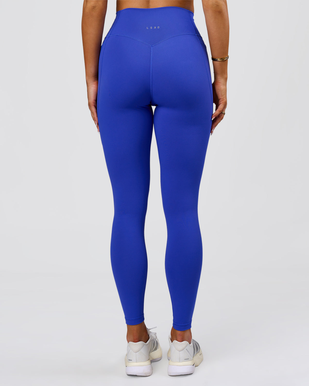 Woman wearing Fusion V-Contour Ultra High-Rise Full Length Legging Pockets - Power Cobalt | Model:Bianca | Size:S - view 1