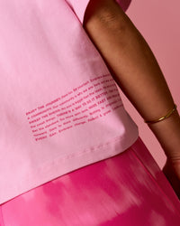 Woman wearing Go-To Heavyweight FLXCotton Graphic Skimmer Tee - Pink Rose-We Rise | Model:Bianca | Size:S | Thumbnail Index: 1