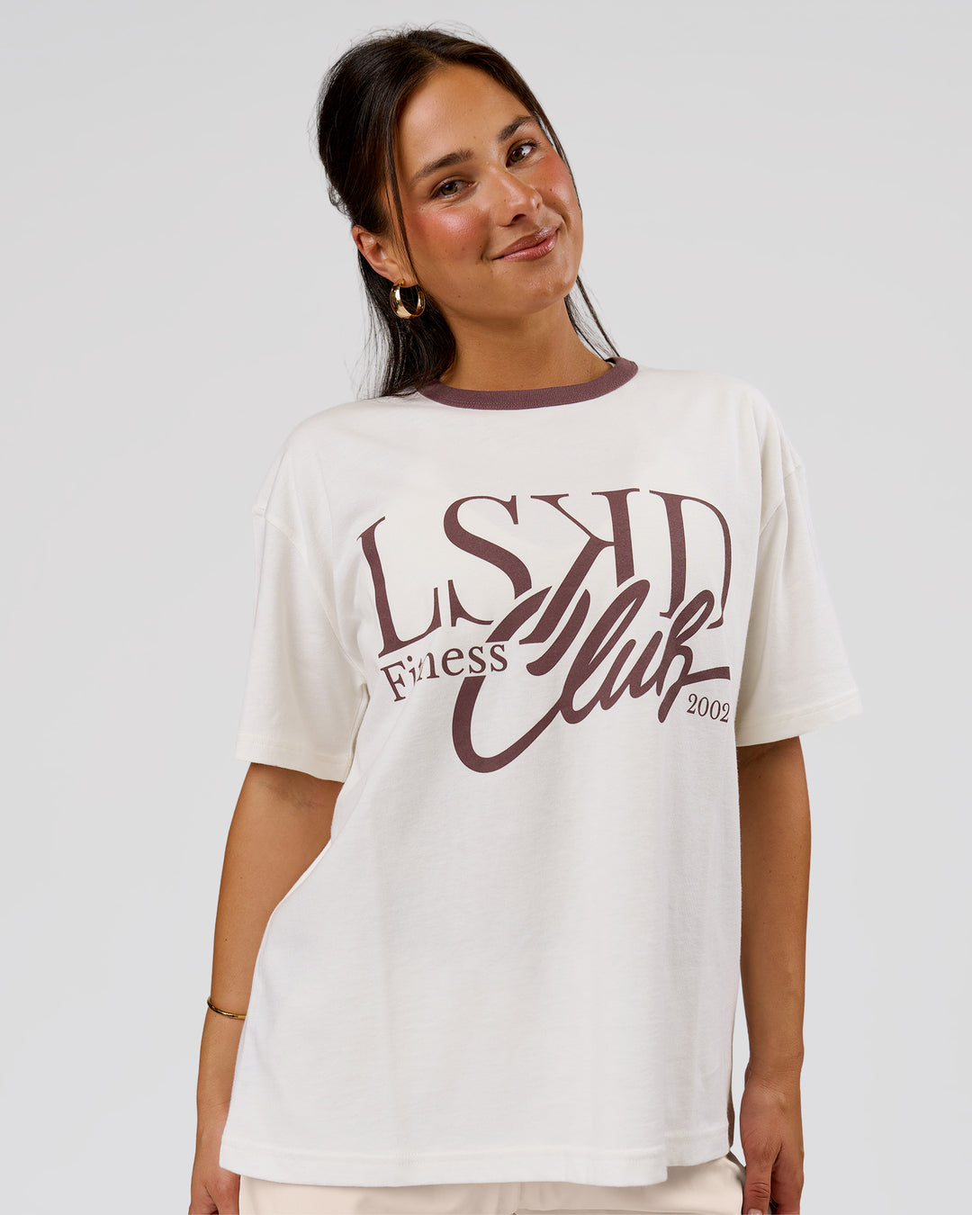 Woman wearing LSKD Fitness Club Heavyweight Oversized Tee - Off White-Cocoa Powder | Model:Bianca | Size:S - view 1