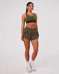 Woman wearing Pacer 3" Run Short - Pure Olive | Model:Bianca | Size:S | Thumbnail Index: 5