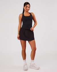 Woman wearing Pacer Skirt - Black | Model:Bianca | Size:S | Thumbnail Index: 4