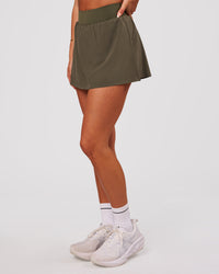 Woman wearing Pacer Skirt - Pure Olive | Model:Bianca | Size:S | Thumbnail Index: 1