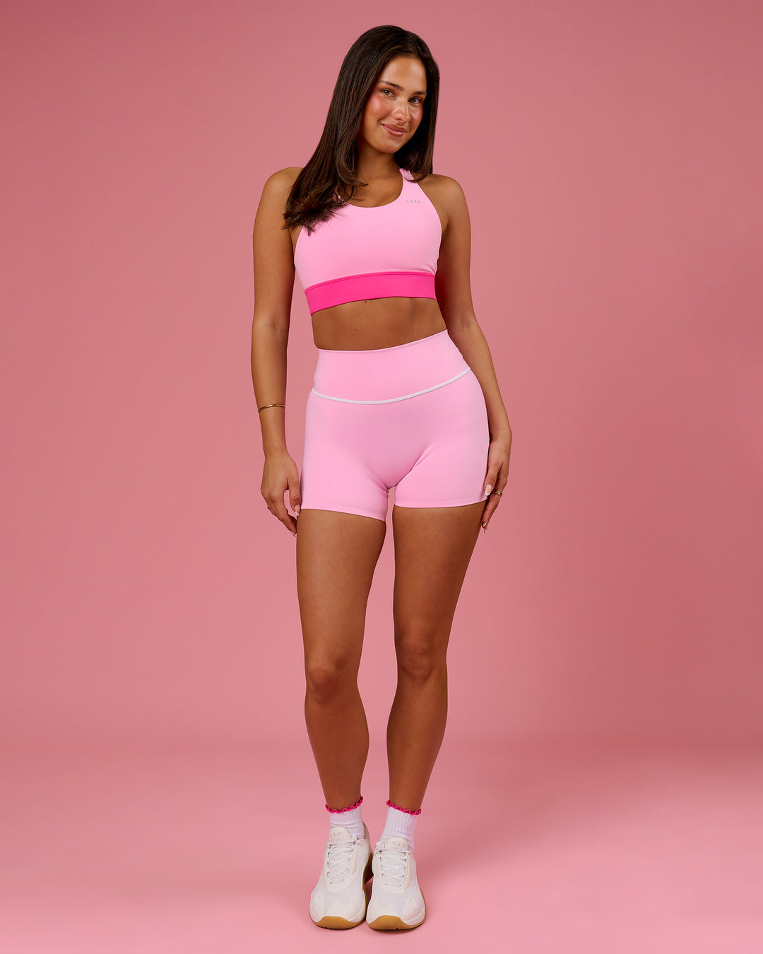 Woman wearing Pinnacle High-Rise 4" Short - Pink Rose-White | Model:Bianca | Size:S - view 6