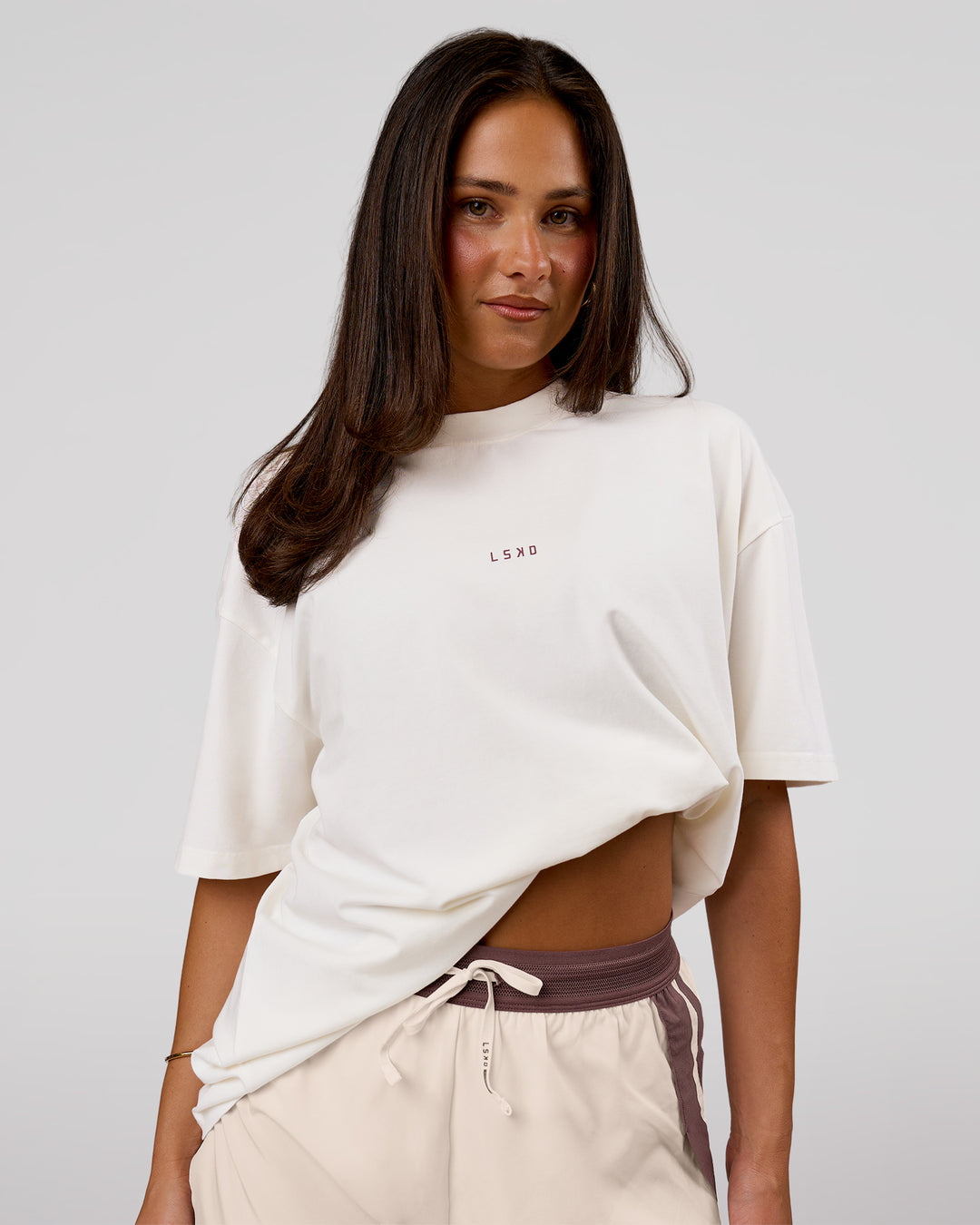 Woman wearing Run Club Unisex Oversized Heavyweight FLXCotton Tee - Off White | Model:Bianca | Size:S - view 8