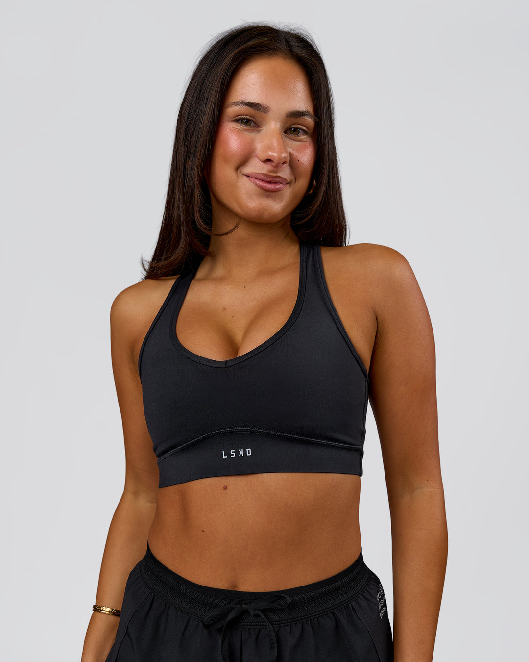 Woman wearing Stamina Amplify Sports Bra - Black | Model:Bianca | Size:S - view 3