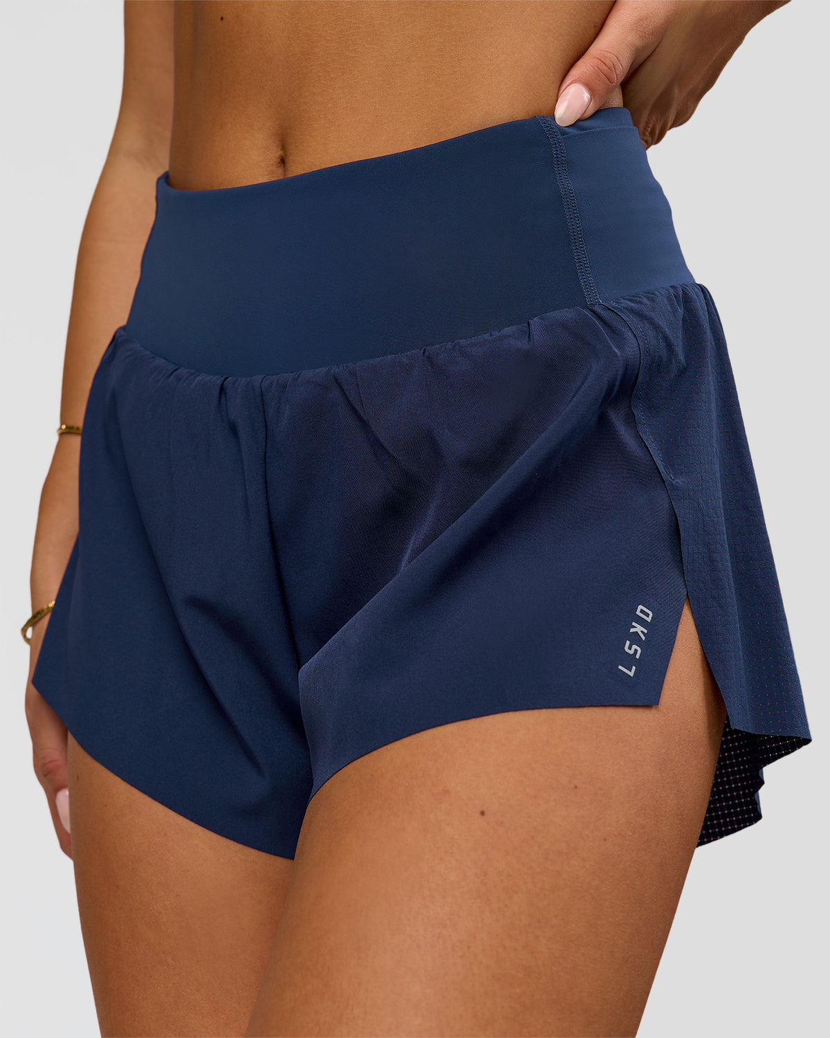 Woman wearing Tia-Clair Toomey-Orr Accelerate 3" Storage Running Short - Future Navy | Model:Bianca | Size:S