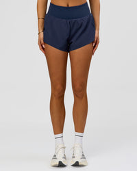 Woman wearing Tia-Clair Toomey-Orr Accelerate 3" Storage Running Short - Future Navy | Model:Bianca | Size:S | Thumbnail Index: 4