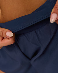 Woman wearing Tia-Clair Toomey-Orr Accelerate 3" Storage Running Short - Future Navy | Model:Bianca | Size:S | Thumbnail Index: 5