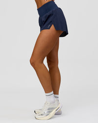 Woman wearing Tia-Clair Toomey-Orr Accelerate 3" Storage Running Short - Future Navy | Model:Bianca | Size:S | Thumbnail Index: 7