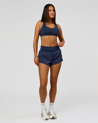 Woman wearing Unstoppable Racerback Sports Bra - Future Navy | Model:Bianca | Size:S | Thumbnail Index: 11