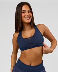 Woman wearing Unstoppable Racerback Sports Bra - Future Navy | Model:Bianca | Size:S | Thumbnail Index: 10