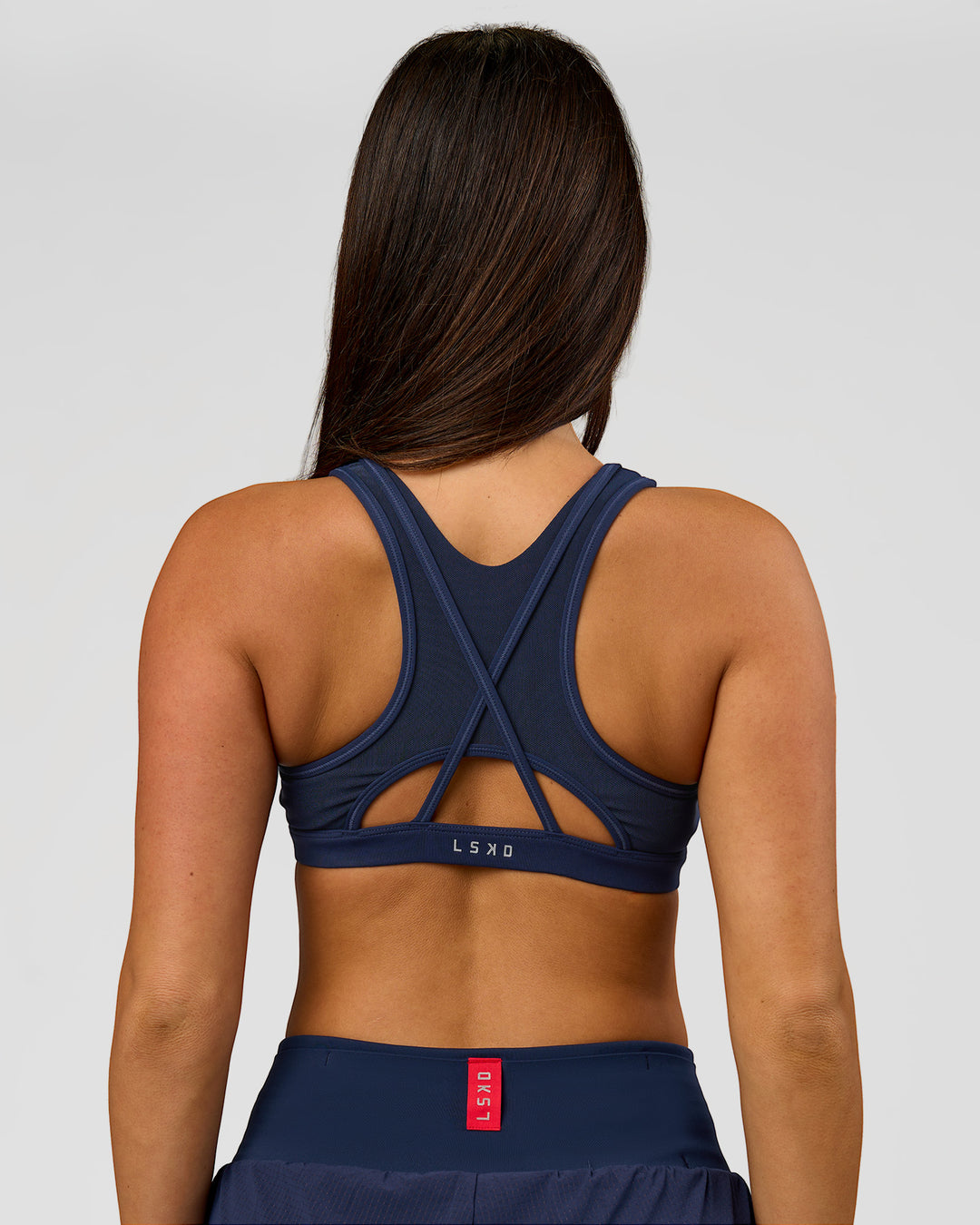 Woman wearing Unstoppable Racerback Sports Bra - Future Navy | Model:Bianca | Size:S - view 9