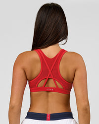 Woman wearing Unstoppable Racerback Sports Bra - Scarlet | Model:Bianca | Size:S | Thumbnail Index: 2