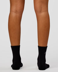 Woman wearing Script Quarter Socks 3 Pack 2.0 - Black-Grey-White | Model:Charli | Size:S | Thumbnail Index: 4