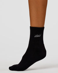 Woman wearing Script Quarter Socks 3 Pack 2.0 - Black-Grey-White | Model:Charli | Size:S | Thumbnail Index: 7