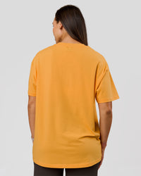Woman wearing VS6 1% Better Fathers Day FLXCotton Oversized Tee - Warm Apricot | Model:Jess | Size:S | Thumbnail Index: 11