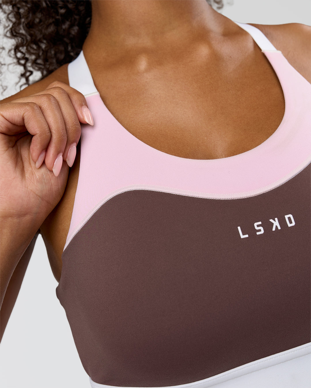 Woman wearing Elevated Accelerate Sports Bra - Cocoa Powder-Marshmallow-White | Model:Jordan | Size:S - view 4