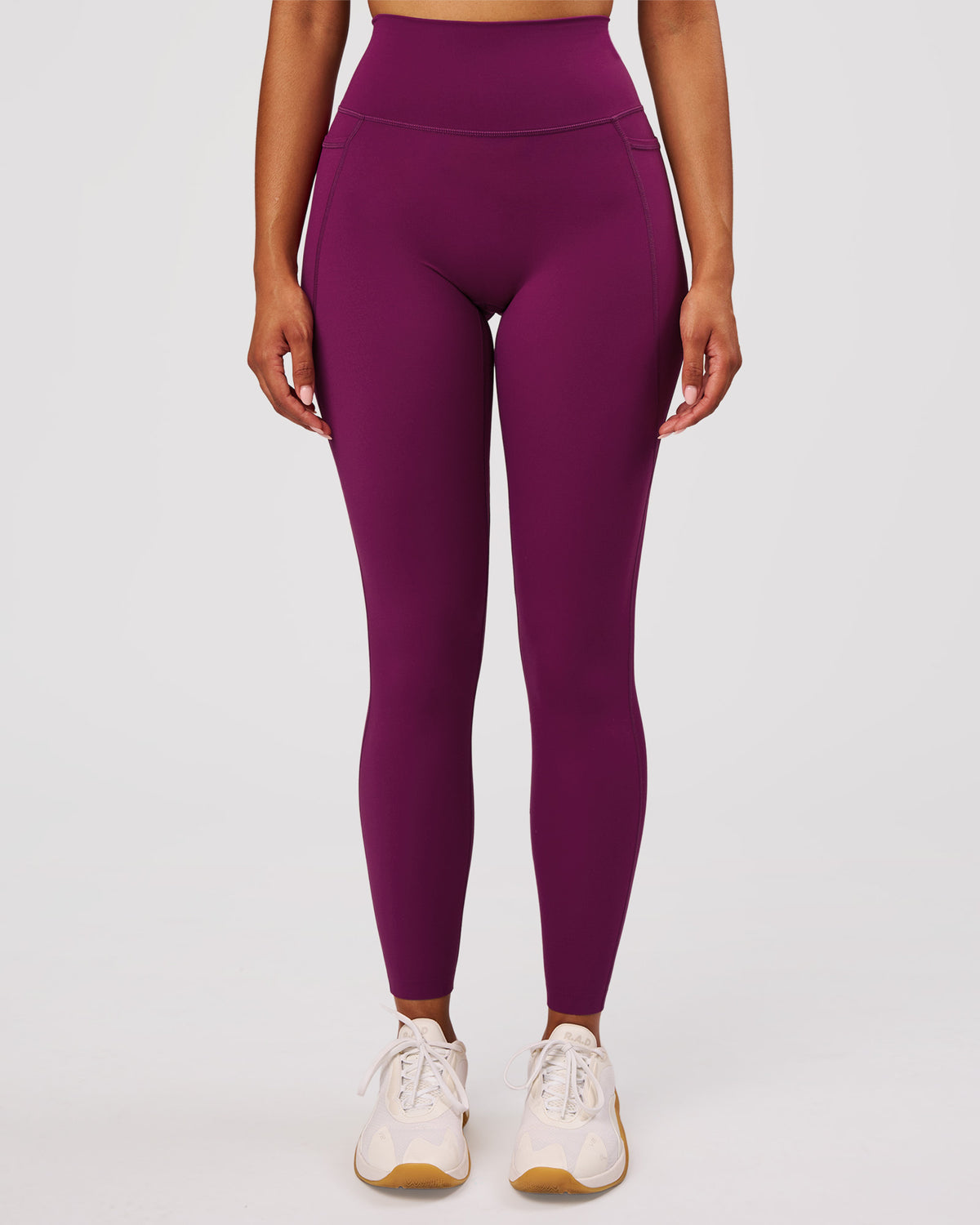 Woman wearing Elixir High-Rise Full Length Legging Pockets - Plum Caspia | Model:Jordan | Size:S - view 1