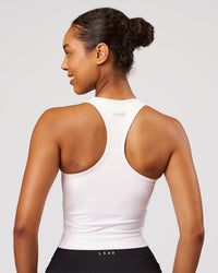 Woman wearing Flow Performance Tank 2.0 - White | Model:Jordan | Size:S | Thumbnail Index: 2