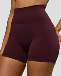 Woman wearing Fusion Ultra High-Rise 4" Short Pockets - Cherry Lacquer | Model:Jordan | Size:S | Thumbnail Index: 0