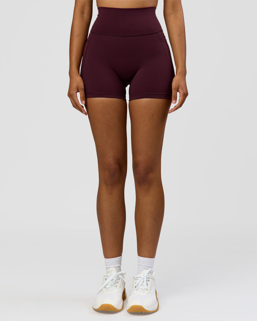 Woman wearing Fusion Ultra High-Rise 4" Short Pockets - Cherry Lacquer | Model:Jordan | Size:S - view 6