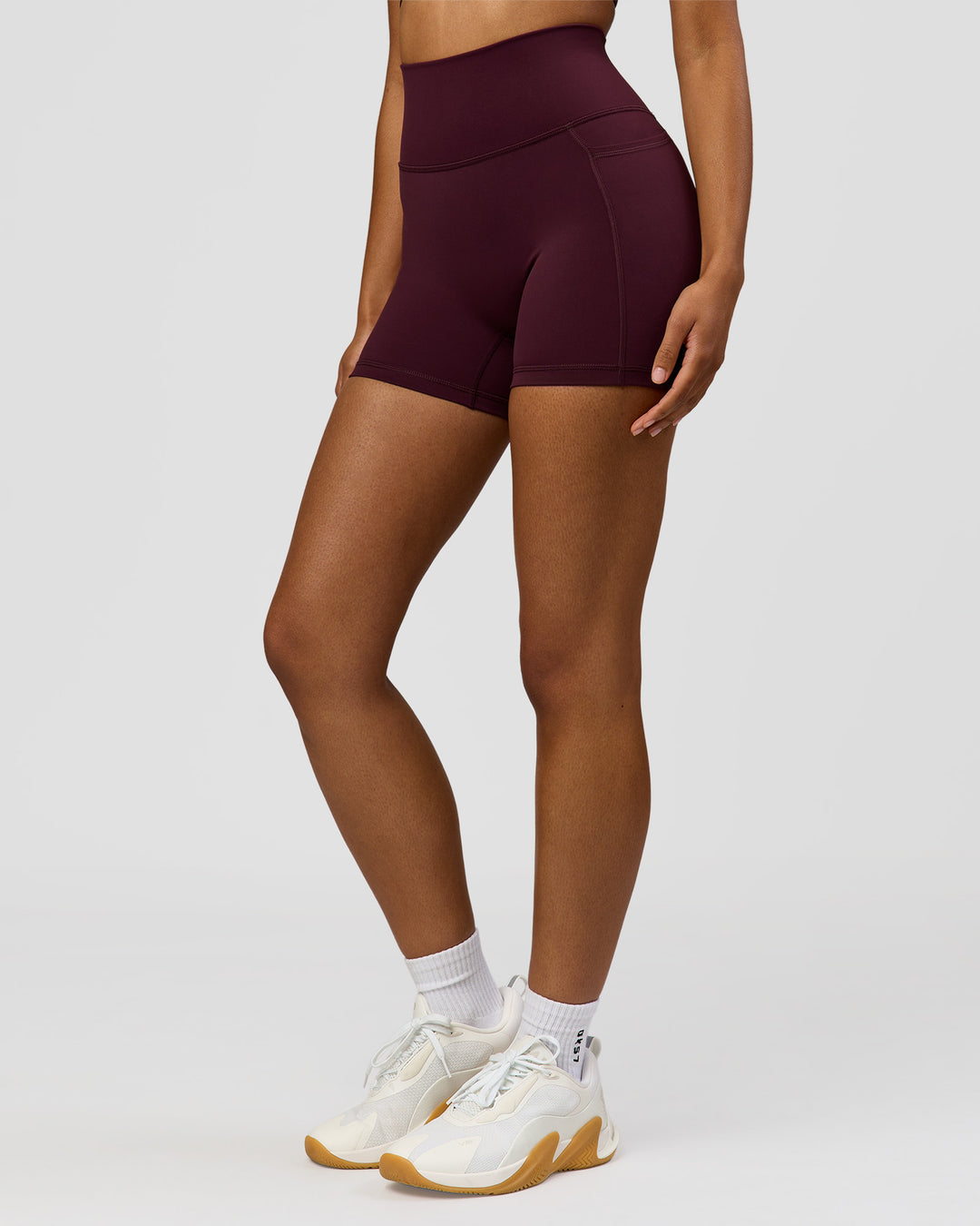 Woman wearing Fusion Ultra High-Rise 4" Short Pockets - Cherry Lacquer | Model:Jordan | Size:S - view 7