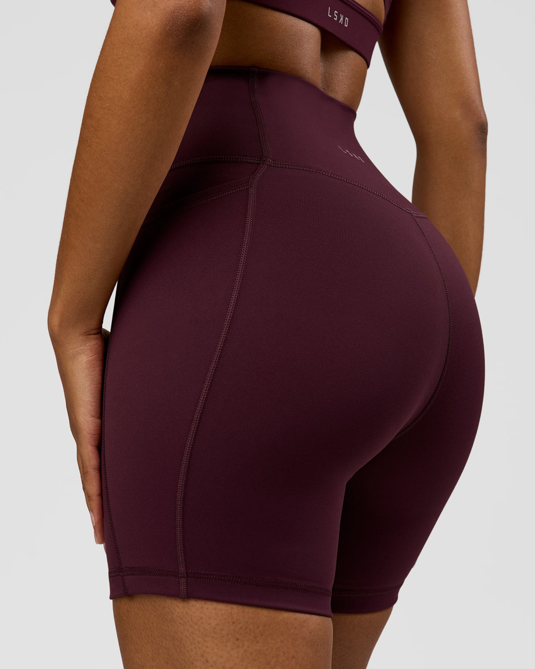 Woman wearing Fusion Ultra High-Rise 6" Short Pockets - Cherry Lacquer | Model:Jordan | Size:S - view 7
