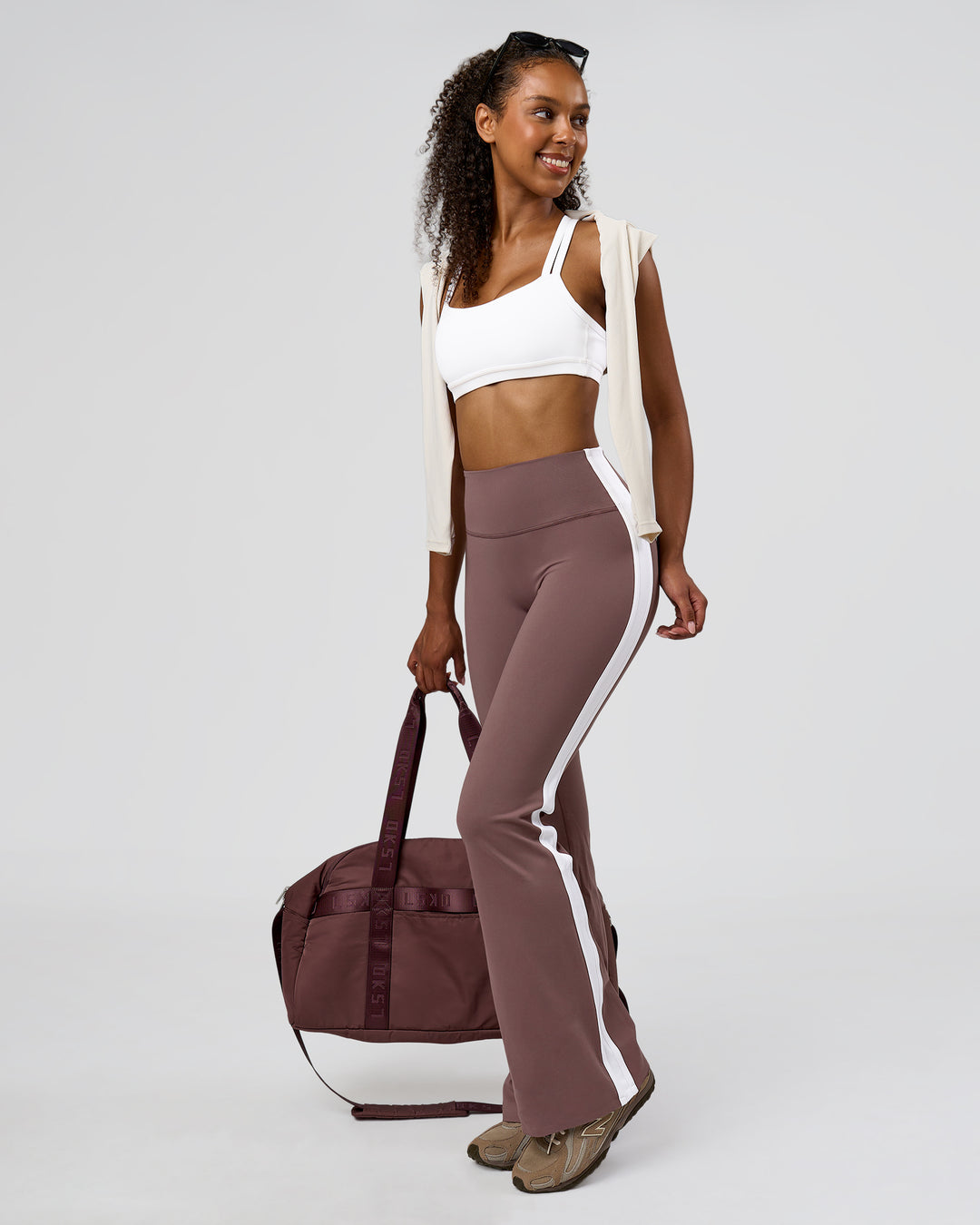 Woman wearing Fusion V-Contour Bind High-Rise Flared Legging - Cocoa Power-White | Model:Jordan | Size:S - view 3
