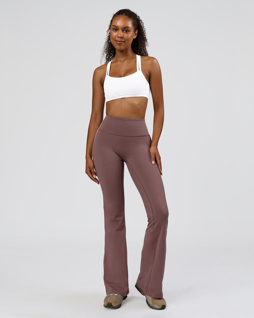 Woman wearing Fusion V-Contour Bind High-Rise Flared Legging - Cocoa Power-White | Model:Jordan | Size:S - view 5