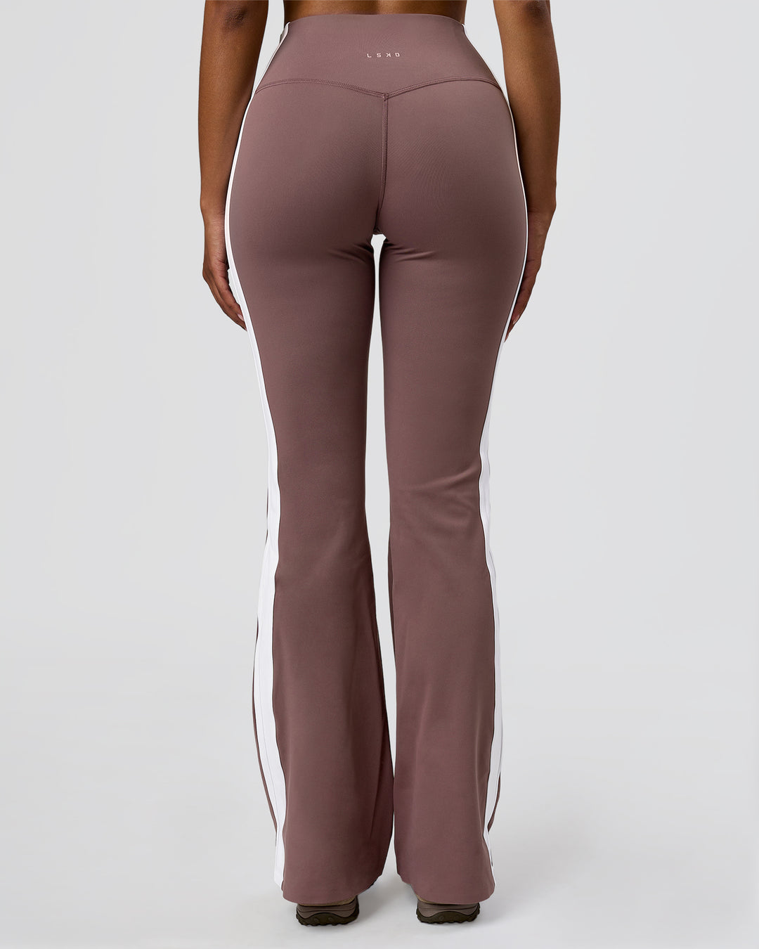 Woman wearing Fusion V-Contour Bind High-Rise Flared Legging - Cocoa Power-White | Model:Jordan | Size:S - view 11