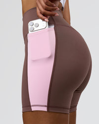 Woman wearing Fusion V-Contour Ultra High-Rise 4" Short Pockets - Cocoa Powder-Marshmallow-White | Model:Jordan | Size:S | Thumbnail Index: 0