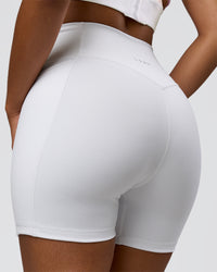Woman wearing Fusion V-Contour Ultra High-Rise 6" Short Pockets - White | Model:Jordan | Size:S | Thumbnail Index: 1