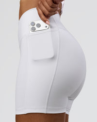 Woman wearing Fusion V-Contour Ultra High-Rise 6" Short Pockets - White | Model:Jordan | Size:S | Thumbnail Index: 0